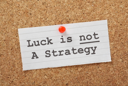 Luck is not a Strategy on a cork notice board as a reminder
